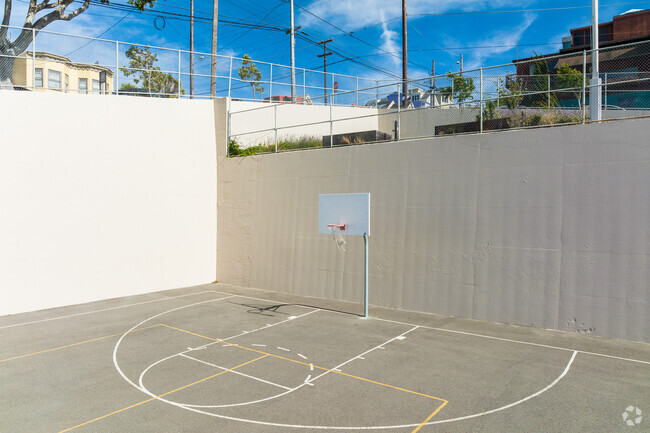 The outside recreation area at Downtown High School includes basketball courts.