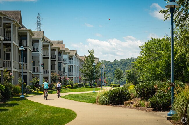 Westside locals ride bikes along the Riverwalk.