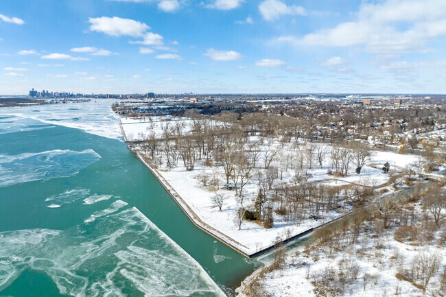 Homes built along canals & overhead view of Maheras-Gentry Historic Park.