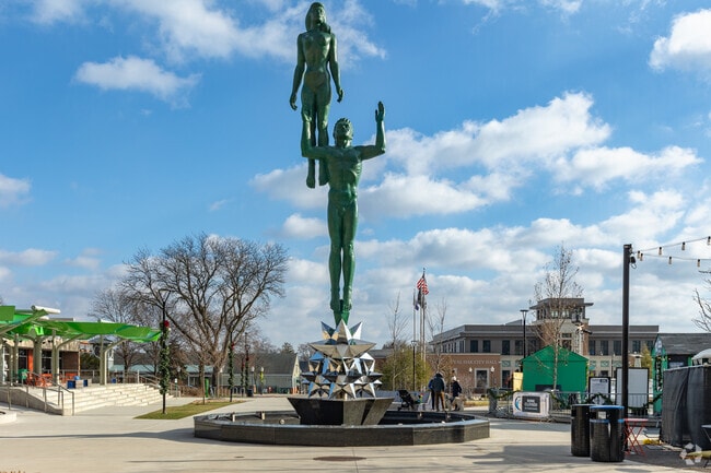 Enjoy the views of the fountain and statue at Centennial Commons Park in Royal Oak.