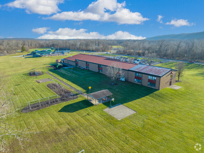 The school is surrounded by acres of land.