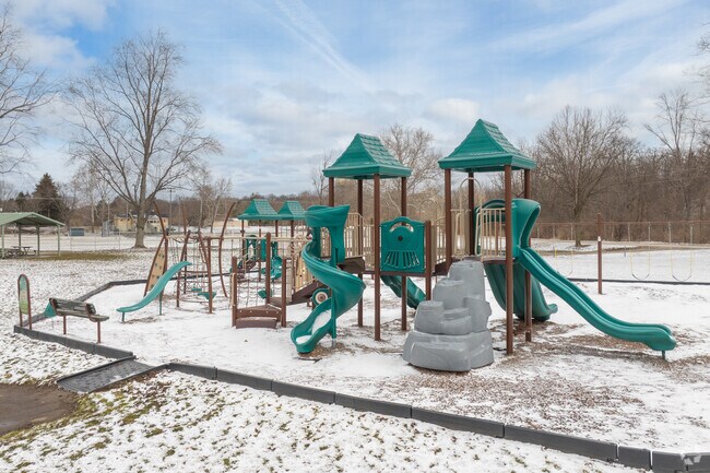 Even a snow-covered playground at Plym Park can still be plenty of fun.