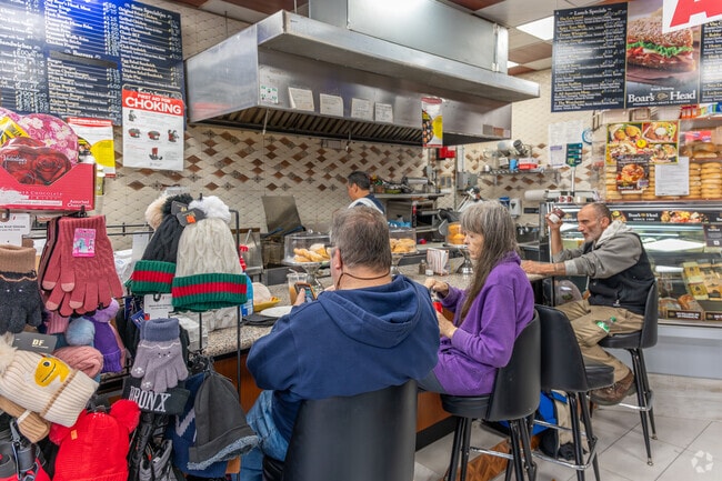 Locals from Bryn Mawr Park enjoy breakfast sandwiches at George’s Luncheonette.