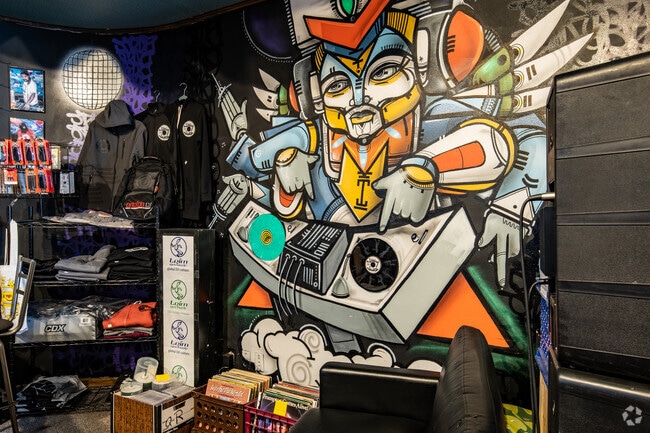 A wall mural decorates the interior of JiggyJamz Records and CDs, a locally owned vinyl store.