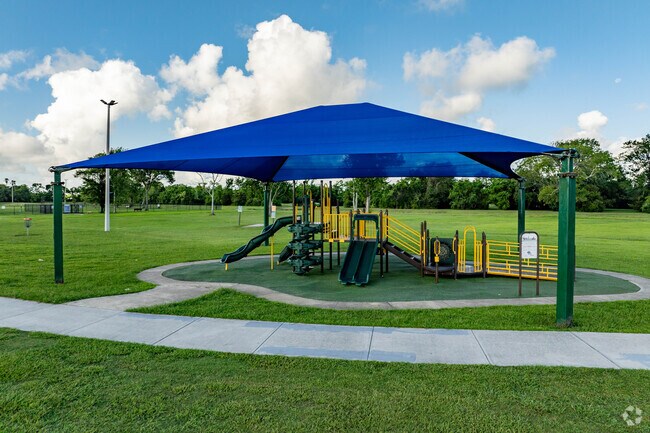 Children of all ages enjoy the covered playground at Bob Briscoe Park.