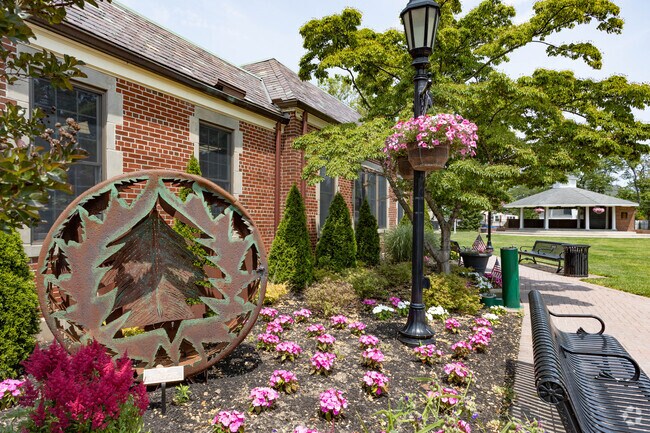Artwork in the Village Green enhances the beautiful gardens in the Farmingdale neighborhood.