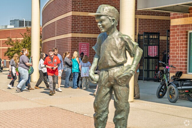 Foster locals line up at the entrance of Jackson Field to watch the Lansing Lugnuts.