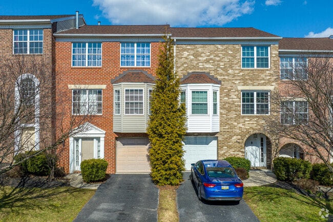 3 story townhomes in East York come with private parking on the bottom floor.