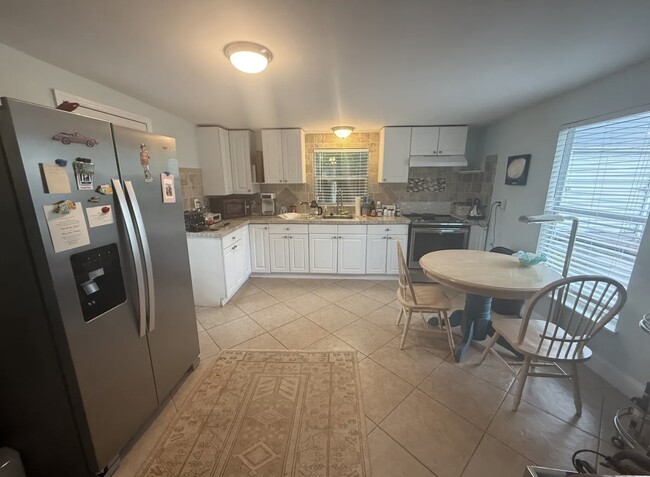 Very big kitchen with lots of cabinets