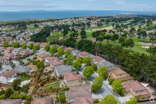 Aerial capturing Spanish style homes with close proximity to the ocean in Seaside, California
