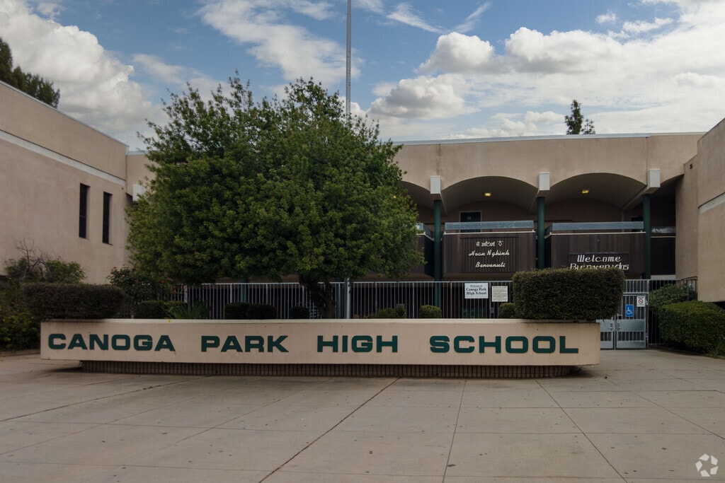 There is large entrance sign in front of the Canoga Park Senior High
School.