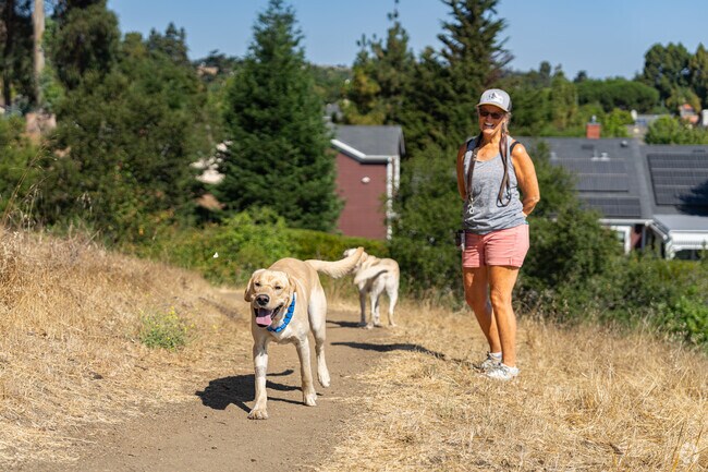 A Prefumo resident enjoys taking her dog on her morning walk on one of the Irish Hills trails.