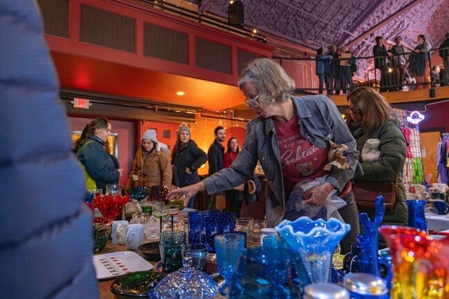 Locals shop for unique items like hand crafted glassware at Somerville Holiday Market.