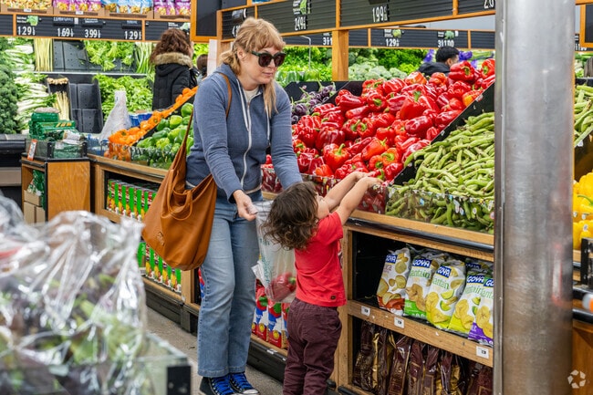 Families shop for groceries together at Sunland Produce in Shadow Hills.