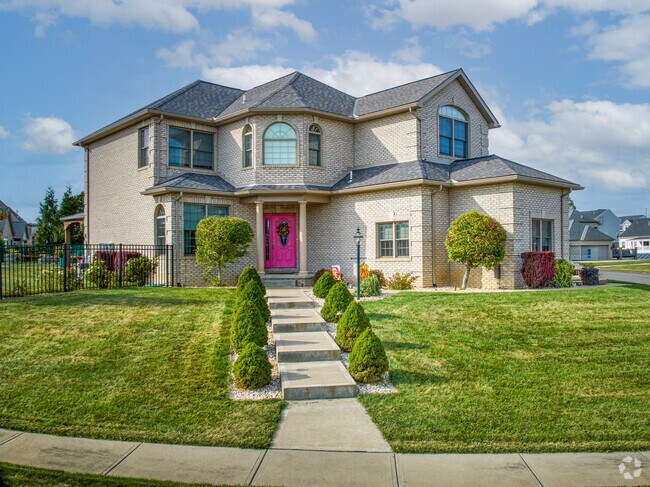 A modern eclectic home sits on a well manicured lot in Findlay Township.