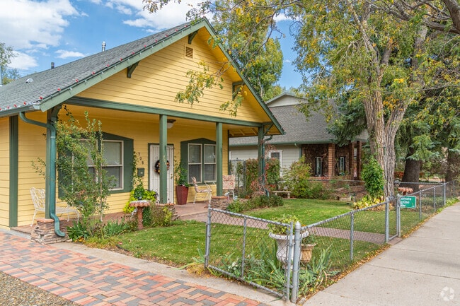 Other North End homes feature covered front porches and wood siding.