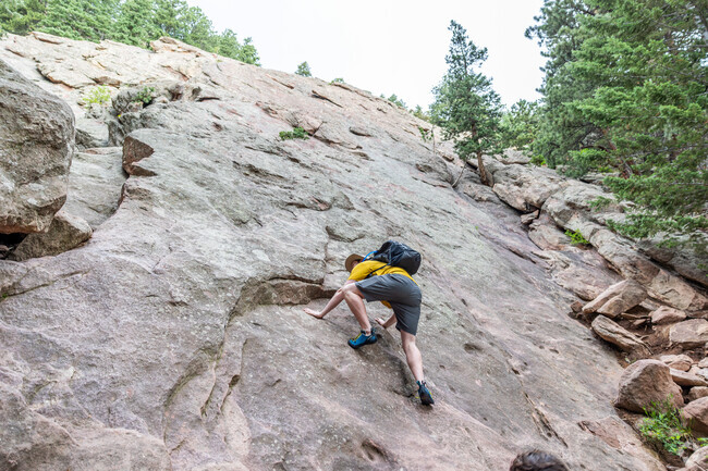 A man begins his ascent of the second Flatiron next to West Pearl.