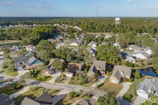 Discover unique styles of homes nestled in a gated community at Wachesaw Plantation East.