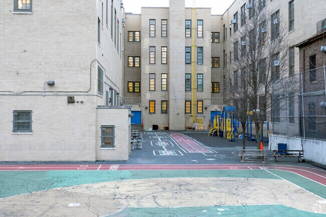 Children at PS 595 love when they get a break to play on the playground.