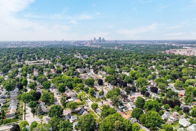The Minneapolis skyline in the distance above Waite Park.