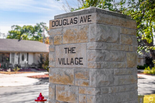 The entry for Village greats you with a stone sign.