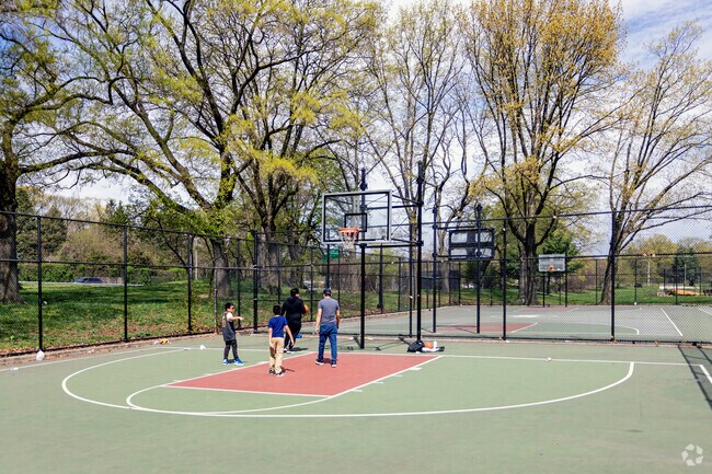 West Farms has a nice basketball courts with people playing some two on two.