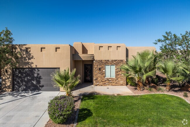 Homes in Sand Hollow Resort have well-kept front lawns and multi-car garages.