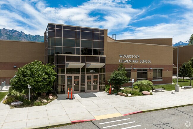 A tall, glass front entrance at Woodstock Elementary School.