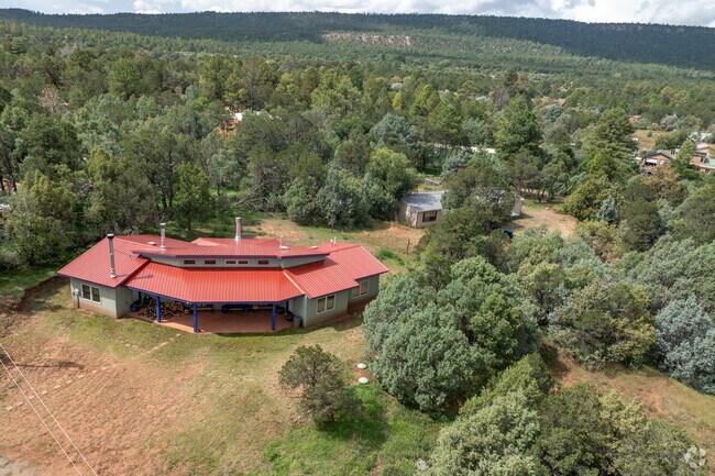 La Cueva locals love that their homes are tucked away into the beautiful trees.