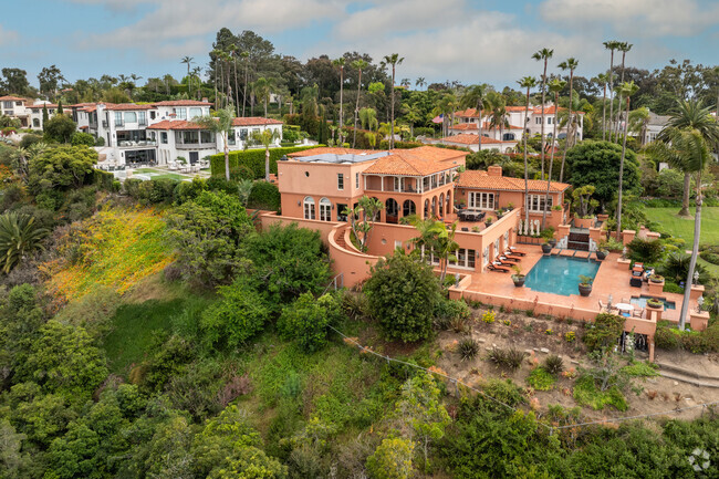 Muirlands is full of large custom mediteranean style homes with ocean views.