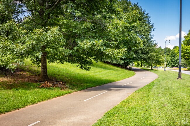Poncey Highland's Freedom Park Trail Path winds through lush greenery & links historic sites.