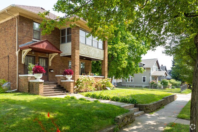 Highland Area has many beautiful residential homes shaded by mature trees.