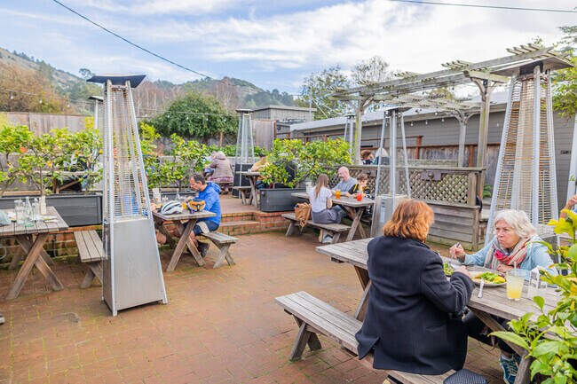 Al fresco dining at Parkside Cafe, immersed in Stinson Beach's charm.