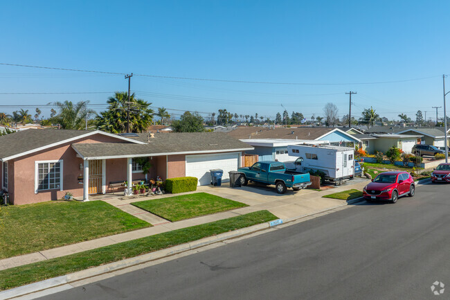 Located just a short drive from the sand, the Adams neighborhood is a well-kept area with a mix of charming single-family homes and modern townhouses, often surrounded by lush, well-manicured lawns.