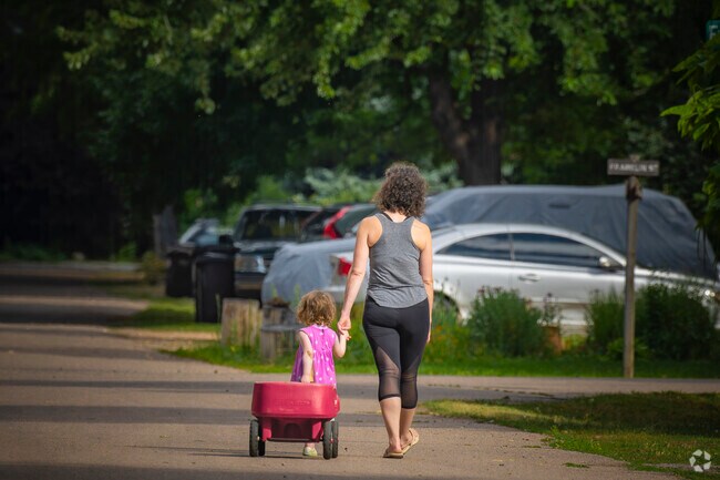 A mother and daughter enjoy a walk home on a summer's day in Niwot, CO.