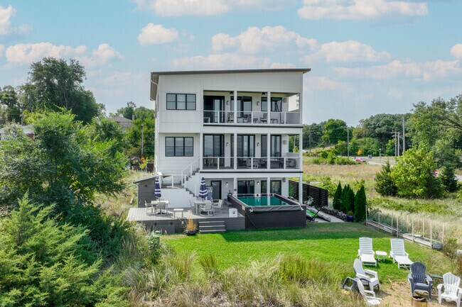 Lakefront homes can often be found with big windows and beautiful landscaping.