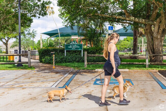 La Mancha resident taking her pups for a walk and enjoying in the scenery in Todd Robiner park.