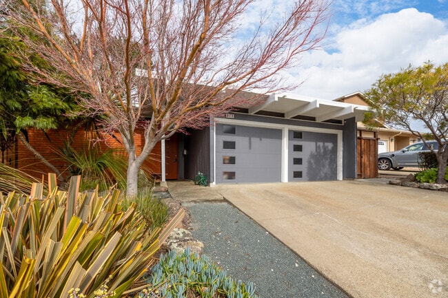 This Millbrae Meadows home showcases a craftsman design with unique garage details.