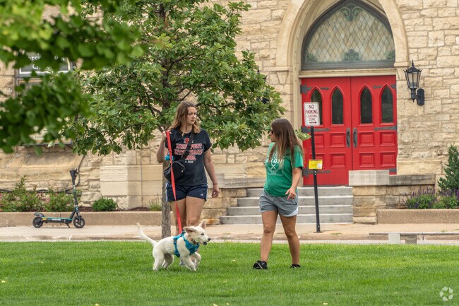 Greene Square Park features well-maintained walking paths and open spaces.