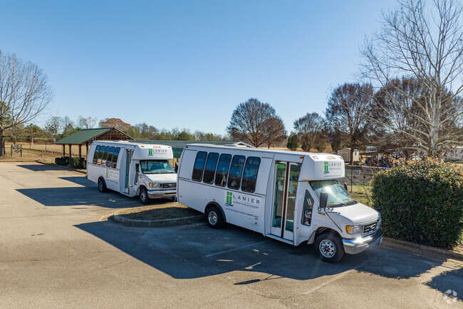 Buses and vans are provided for student pick up and drop off.