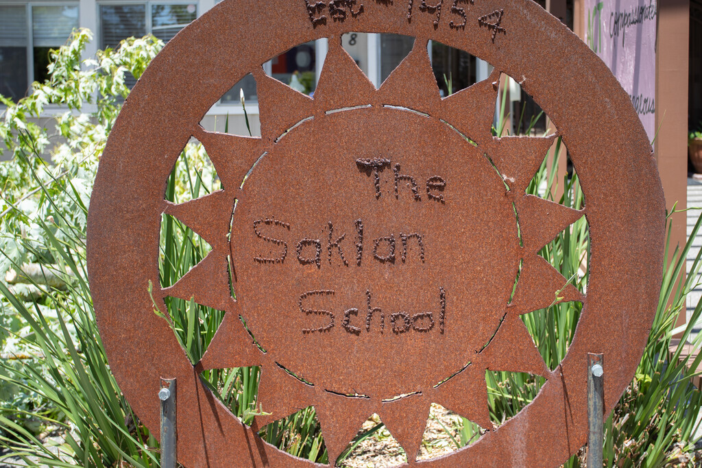 The Saklan School entrance is decoated with different types of art for visitors and students.