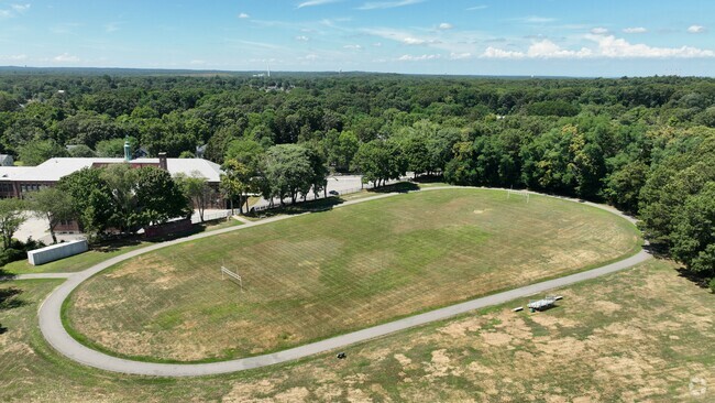 The William T Rogers Middle School sports field has a track that wraps around the land.