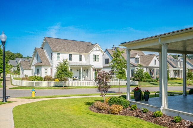 Neighborhood streets wrap around these beautiful white houses in Hoover.
