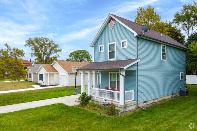 Some traditional and farmhouse-style homes line the streets of ONYX.