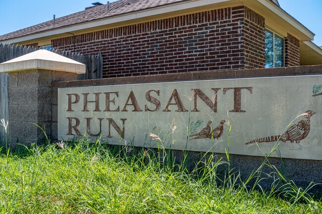 Residents are greeted by neighborhood signs in the Pheasant Run community.