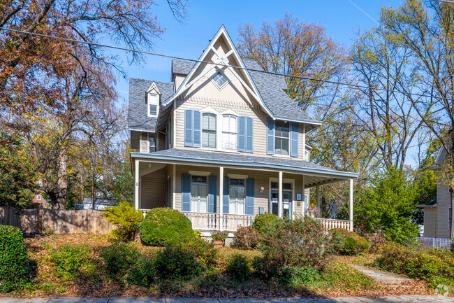 A Queen Anne style home with a wrap around porch and spacious yard in Hyattsville.