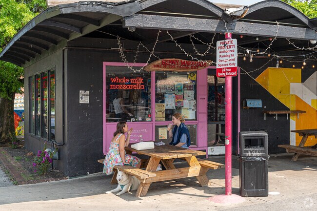 Blacksburg locals enjoy a pizza slice from Benny Marzano's.