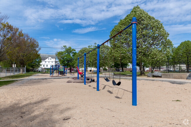 Students have fun on the swings at Roger Williams Middle School in Lower South Providence, RI.