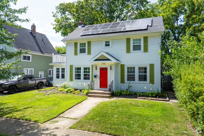 This colonial style home in North End Square features an eye-catching red door.