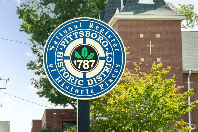 The blue signage for the Pittsboro Historic District.